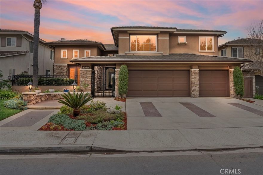 Welcome to 22591 Wakefield, a stunning home in the impressive, guard-gated community of Canyon Crest Estates. This exceptional pool home features a serene backyard retreat and offers nearly 3,300 square feet of luxurious living space, including 4 bedrooms, 3.5 bathrooms, and a large downstairs office that could easily be converted into a perfect downstairs bedroom or guest suite. Built in 1996 by the award-winning builder Taylor Woodrow, this remarkable steel-framed home is situated at the end of a quiet, single-loaded street, providing a peaceful and private setting.
 
Stepping through the custom iron door, you are instantly welcomed by a grand foyer that boasts soaring ceilings and an abundance of natural light. The breathtaking outdoor backdrop sets the scene. This formal living and dining area is perfectly designed for hosting or relaxing. The centerpiece of the home is the chef-inspired kitchen, featuring a spacious center island equipped with a 5-burner cooktop. With double ovens and ample storage, this kitchen combines both functionality and style. It seamlessly opens into a casual dining area and a cozy family room, which includes a gas fireplace, custom-built cabinets, and a wet bar.
 
Upstairs, you will find a spacious primary suite that opens up to a large upper deck. The en-suite bathroom features a walk-in shower, a relaxing soaking tub, dual sinks, and a generous walk-in closet. Additionally, there are three other generously sized secondary bedrooms that provide ample space for family or guests. 

The home's outdoor space is a true paradise. The resort-style backyard boasts a stunning Pebble-Tec pool, complete with a serene spa and a picturesque waterfall, creating a tranquil oasis. A spacious built-in BBQ island invites memorable cookouts, while a custom fireplace provides the perfect setting for gathering with friends and family. The expansive patio deck, featuring a graceful winding staircase, offers multiple levels for relaxation and enjoyment. Other home features include plantation shutters, a separate laundry room with a laundry chute, ample storage, a spacious 3-car garage, a dual-zone HVAC system, and fresh neutral paint throughout.
 
Canyon Crest Estates provides a country-club lifestyle with amenities such as a clubhouse, fitness center, pools, sports courts, a children's play area, and BBQ areas. The community is conveniently located near shops, restaurants, award-winning schools, and the beautiful Mission Viejo Lake.