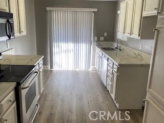Available Now in the community of the "Hills"...Beautiful lower level corner unit 2 Bedrooms with Walk In Closets, 2 Bathrooms, New Flooring, New Quartz Kitchen and Bathroom Counter Tops , Living Room with Fireplace, Formal Dining Room, Upgraded Kitchen with Quartz Counters, Breakfast Nook, Large Warp Around Patio that has access from Master, Kitchen and Living Room, Separate Laundry Room next to Patio, Extra Storage by Front Door is a Plus...2 Assigned Carports # 142/143...HOA Amenities Offer Pool, Spa, Tennis Court, Gym and Kids Play Area. Yorba Linda High School. Rent covers Trash and Water.