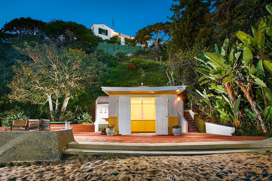 This oceanfront estate parcel is on the sand in the esteemed private community of Emerald Bay. Held in the same family since 1932, &#8216;EL PARADOR&#8217; presents a rare opportunity to buy the &#8220;best of the best&#8221; as the original owner had her choice of most any position on this scenic cove. The current offering was assembled in a recent merger of the original lot #156 with a substantial portion of the former lot #120, creating the newly expanded parcel #156; now the single largest on the oceanfront in all of Emerald Bay. It features a private beach area with almost 70&#8217; of frontage at the quiet western end of the cove, as well as a sand-front cabana and large entertaining terrace. The existing, 1930&#8217;s California colonial style home serves as a comfortable beach getaway. Alternatively, one could build new and create a home of 13,000 square feet or larger, with an oceanfront swimming pool, and direct walk-out-on-the-sand access from a beachfront cabana and terrace. The gently sloping topography will allow for an exceptionally livable new plan with all floors taking in ocean views. Street to street access allows for an oversized multi-car subterranean garage. The cove, coastline, ocean and nightlight views are beyond compare, as is this irreplaceable opportunity.