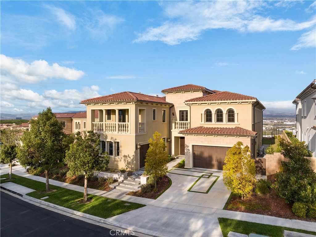 Situated on the BEST view street in the prestigious 24/7 guard-gated community of Hidden Canyon. Extraordinary rare to find over 10,000 sqft lot with 180 degree panoramic city and mountain view in this community. The Most prestige “Marbella” Collection features 5 Bedrooms, 5.5 Bathrooms, main level Den plus a spacious Loft. You will be amazed by gorgeous and elegant Foyer with High Ceilings. Formal living room proudly displays a cozy fireplace, an ideal space for entertaining family and guests. Gourmet kitchen features dual islands with marble countertop and wood cabinetry, Sub-Zero & WOLF appliances. Follow the grand staircase up to an open loft for home entertainment. Luxurious master suite features an oversized bedroom connected to a spacious viewing balcony, a large retreat area, custom bath with dual vanities, spa like tub and spacious walk-in closet. The Hidden Canyon Community offers resort style amenities including top-class pool, cabanas, a clubhouse, playgrounds and hiking trails. Part of Irvine’s award-winning University High School District. Minutes away from Irvine Spectrum, Laguna Beach, UCI and freeways.