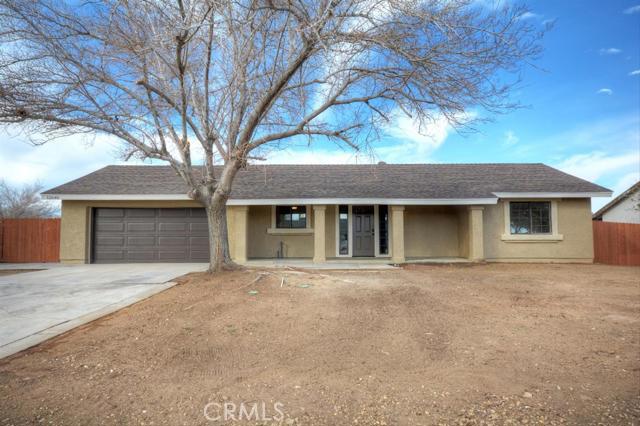 Come see this great home in the desired neighborhood of Victorville that has been completely revamped inside and out with a large 30`x 40` workshop. The nice desert landscaping is accentuated in the front and backyard, boasting new exterior and interior paint. Once inside, you'll be in awe of the gorgeous vibrant kitchen with new quartz counter tops and clean stainless steel appliances. New LED lighting throughout the home illuminates the easy to clean laminate flooring in the common areas, plush, comforting carpet in the bedrooms, and new tile added in the bathroom. Complete with a classic vanity, sparkling lighting, and modern fixtures, the washroom adds to the desert feel of the home. With a great backyard, huge workshop, and new garage door, you won't want to miss out! It will go fast so see it today! Association Amenities: None # of RV Spaces: 0NONE Lot Location Type: Standard Location Special Features: None # of Attached Spaces: 2 # of Detached Spaces: 2