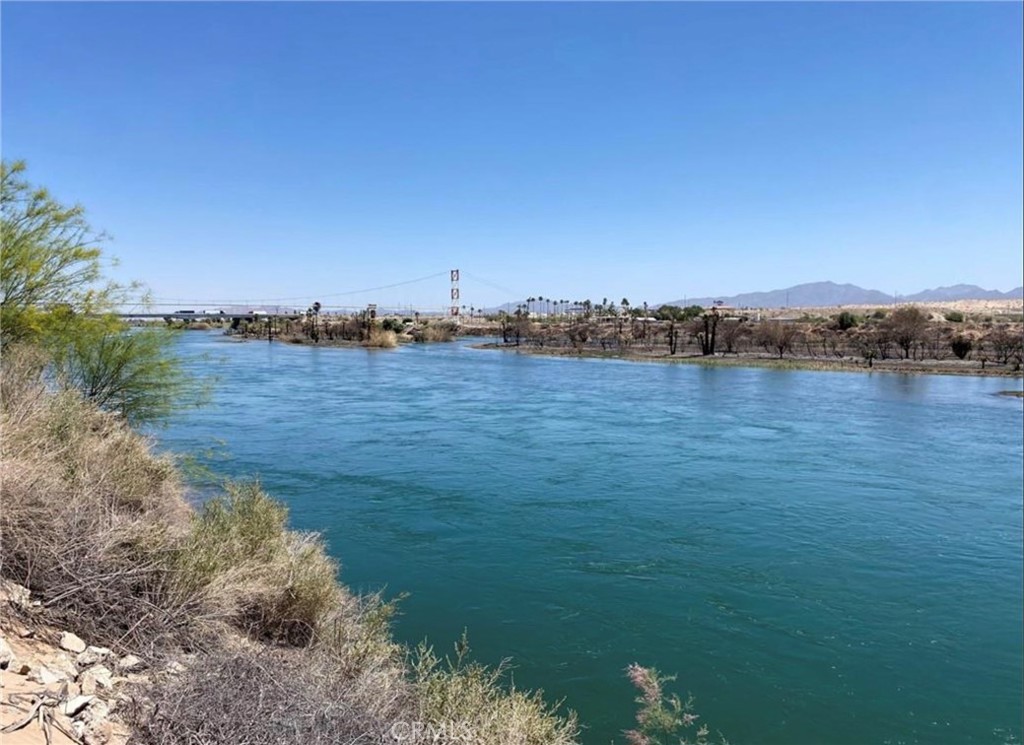 COLORADO RIVERFRONT LOT. Beautiful river and desert views on a great spot on the river about a half mile south of the I-10 freeway. Build your dream desert getaway. Lot is over a half acre at 25,265 square feet (approx 55' wide by 422' deep) and is big enough to build your home AND a toy barn for all your toys. Access to electricity and city water. Location is close to the freeway which allows for quick access to town, gas, restaurants, etc. Blythe is the closest place on the River to Southern California and Phoenix which shortens your travel time for the weekend getaways. Boat launches are nearby.