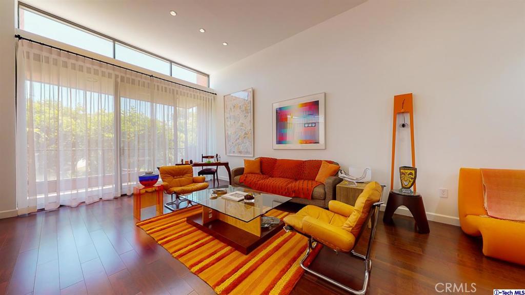 Modern luxury, convenience and sophistication blend seamlessly to bring you this light and bright 2 bed 2.5 bath top floor unit in one of the most sought after buildings in Beverly Hills! Overlooking tranquil treetop views, this prime unit features chic, designer finishes throughout including high ceilings, a step down living room with large walls -perfect for showcasing artwork, a gourmet chef's kitchen, private balcony and wood floors that span the entirety of the ideal floor plan! The spacious primary bedroom suite feels like your own private penthouse boasting a huge walk-in closet and a resort-like bathroom with a large soaking tub, detached glass shower and your very own dry sauna! All set in the best location just a stone's throw to Roxbury Park and close proximity to shops and dining on nearby Rodeo Drive!