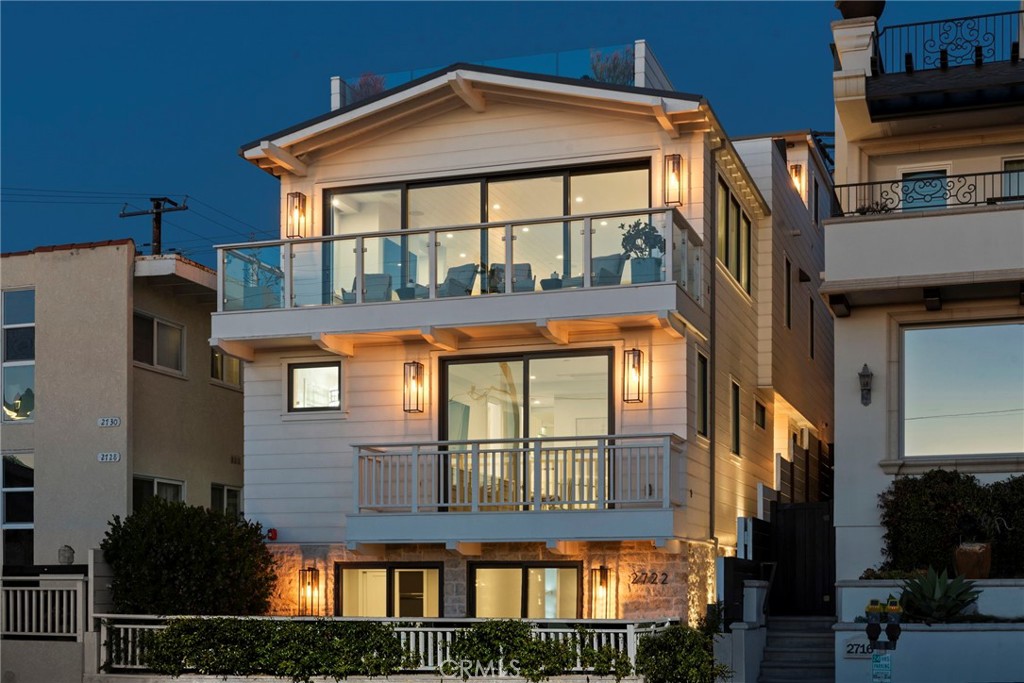 Experience 2722 Hermosa Avenue—your unparalleled coastal escape, just steps from the sand. Discover a sanctuary of modern elegance and refined relaxation at this stunning custom-built residence, nestled in the heart of Hermosa Beach’s coveted sand section. Designed by renowned architect Mark Trotter and built by Titan & Co. in 2020, this 4-bedroom, 6-bathroom masterpiece redefines luxury living. With 4,753 square feet of sophisticated interiors spread across four levels accessible by a 4-stop elevator, this home offers panoramic ocean views, unparalleled privacy, and world-class amenities at every turn. From the moment you step inside, sophistication meets seamless automation. A state-of-the-art Control4 system integrates effortlessly with Lutron lighting and shades to set the mood for any occasion, while nine climate-controlled zones ensure personalized comfort throughout the home. The first level features three luxurious en-suite bedrooms, a spacious living area with a wet bar, and a golf simulator practice room/office space. The second level welcomes you with an inviting primary suite, complete with a custom walk-in closet and spa-inspired bathroom. The oversized garage is both practical and innovative, featuring a Tesla battery center with solar panels, a water conditioning system, and an A/V technology center that blends modern convenience with eco-conscious living. The third level is a chef’s dream, with a meticulously designed kitchen featuring Sub-Zero refrigerator and freezer columns, Wolf range top and double oven, and Mattaliano Conique pendant lighting. Entertain effortlessly with a Butler’s pantry, fully equipped with a Miele coffee system, steam oven, and Grohe Blue chilled sparkling water system. Every detail is designed for unforgettable gatherings, all framed by captivating seated ocean views from the dining, kitchen and living areas. The top level is where the home truly shines, featuring a rooftop deck with sweeping ocean views. Enjoy sunset cocktails at the full bar, equipped with Sub-Zero refrigeration and a Nugget ice maker or unwind by the gas fire table outside as the ocean breeze sets the perfect ambiance. From curated designer lighting to cutting-edge technology, every inch of this home exudes timeless sophistication and modern luxury. Whether savoring a peaceful morning on the rooftop or hosting in the gourmet kitchen, this architectural masterpiece offers a lifestyle as seamless and breathtaking as the ocean views.