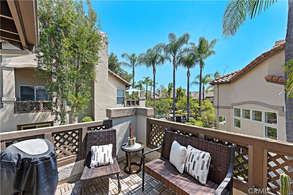 MARVELOUS MISSION VIEJO VIEW CONDO! This beautiful Ashton Community condo features two large bedrooms, two fully remodeled baths, an upstairs loft and a large storage area. This classic condo features upgraded stainless steel appliances; refrigerator, gas stove, and dishwasher. The kitchen has granite countertops, track lighting, and an abundance of cabinets. Additional features include exquisite living room fireplace, high vaulted ceilings, open floor plan, lots of natural light, custom wood floors and baseboards. Master bedroom features large view window, mirrored wardrobe doors. The large secondary bedroom also has mirrored closet doors and lots of natural light and is ideally located near the stairs going up to the loft. The loft is perfect for a home gym, office, retreat or a 3rd bedroom; the open architecture gives you a wonderful view of the dining room, living room and kitchen below. Also, at the top of the stairs is the entrance, to the very large storage area. The storage area/room has a lot of options, in addition to storage. The spectacular view from the patio is a key feature of this home. The view of the palm trees and pool area is perfect for relaxing with a morning cup of coffee and watching the sunrise or the night sky… or any other time of the day. Additionally, the spacious patio includes teak flooring and gas outlet for your own BBQ and room for entertaining. Enjoy the “Mission Viejo” lifestyle which includes all the facilities of Lake Mission Viejo….Clubhouse, volleyball, snack bar, boating, finishing or just lying on the beach. Your will live in one of the best areas of Southern California which is ideally situated near schools, dining, shopping, parks, bike trails, recreation areas and a short drive to Southern California beaches!