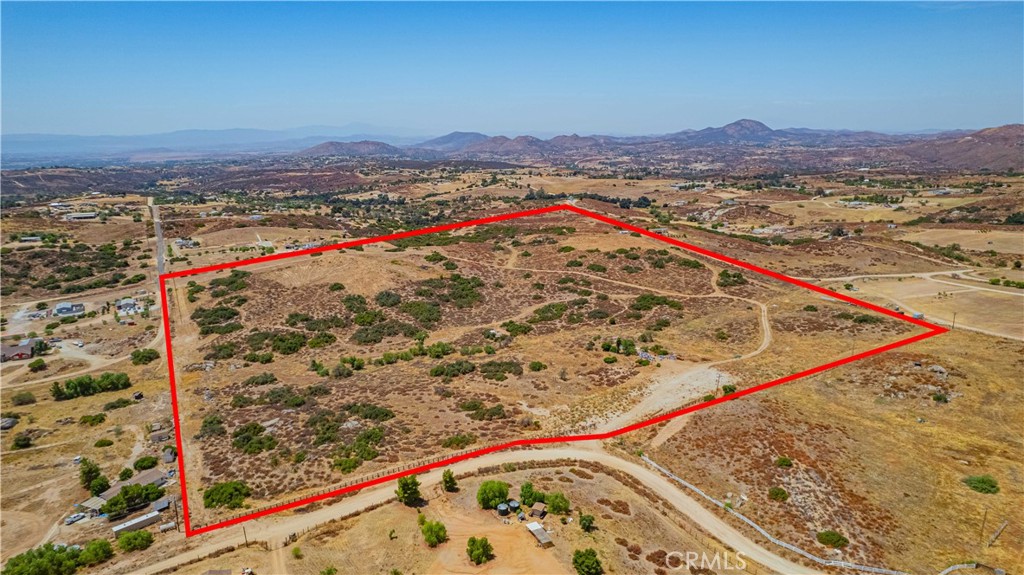 Opportunity meets imagination on this breathtaking 39.68-acre parcel, set just east of Southern California’s premier wine and equestrian region of Temecula — a place known for its rolling vineyards, boutique wineries, luxury estates, and vibrant lifestyle. Surrounded by open skies and stunning panoramic views of hills, valleys, and distant mountains, this land offers a rare blend of natural beauty and investment potential. Access is easy via a well-maintained road, and electricity is available at the property line. The land is partially fenced and features its own well, drilled by LO Lynch. Enjoy the serenity of wide-open spaces while still being a short drive to acclaimed Temecula wineries, farm-to-table restaurants, charming Old Town shopping, and year-round events that draw visitors from around the world. Currently, a small beekeeping operation is underway near the entrance — just a hint of the property’s productive potential.Create your vision in a region where lifestyle and land truly come together.
Buyer to conduct their own independent investigations to verify all information including but not limited to: zoning, land use regulations, access, easements, boundaries, permitted uses, well and utility availability, property lines, lot size, tax rates, and any potential restrictions with the County of Riverside or other governing agencies. All information provided is deemed reliable but is not guaranteed, and should not be relied upon without proper verification by the buyer and/or their designated professionals. Neither seller nor listing broker/agent makes any warranties, express or implied, as to the accuracy of the information contained herein.