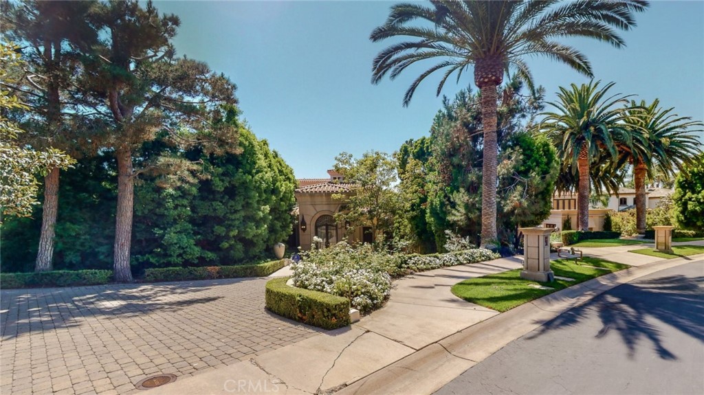 One of the finest residences in Newport Coast in the Pelican Hill state. A rare tennis court and pool estate built by Fari. stunning golf course and ocean views. Gracious and inviting outdoor loggia entry secured behind gated doors leads to an expansive foyer entry and tennis and basketball court with professional outdoor lighting. Marble flooring and chandelier in the foyer with bifurcated stairs leading you to the master bedroom. An enlarged master suite includes his and her bath and dressing rooms, a sitting room, bedroom and private ocean view terrace. Awe-inspiring views of the Catalina Island, Pelican golf course, and the harbor from the living room and formal dining room. Gourmet kitchen that opens to warm, view-oriented family room. a fifth bedroom suite on the main floor. Three levels serviced by a commercial elevator. Theater on basement level shares with the 5th suite, second full bath, indoor lap pool, dry sauna, mirrored gym with state-of-the-art cardio equipment. Outdoor pool with spa overlooking the Pelican Hills Golf Course and the Pacific Ocean to entertain all your guests and families.