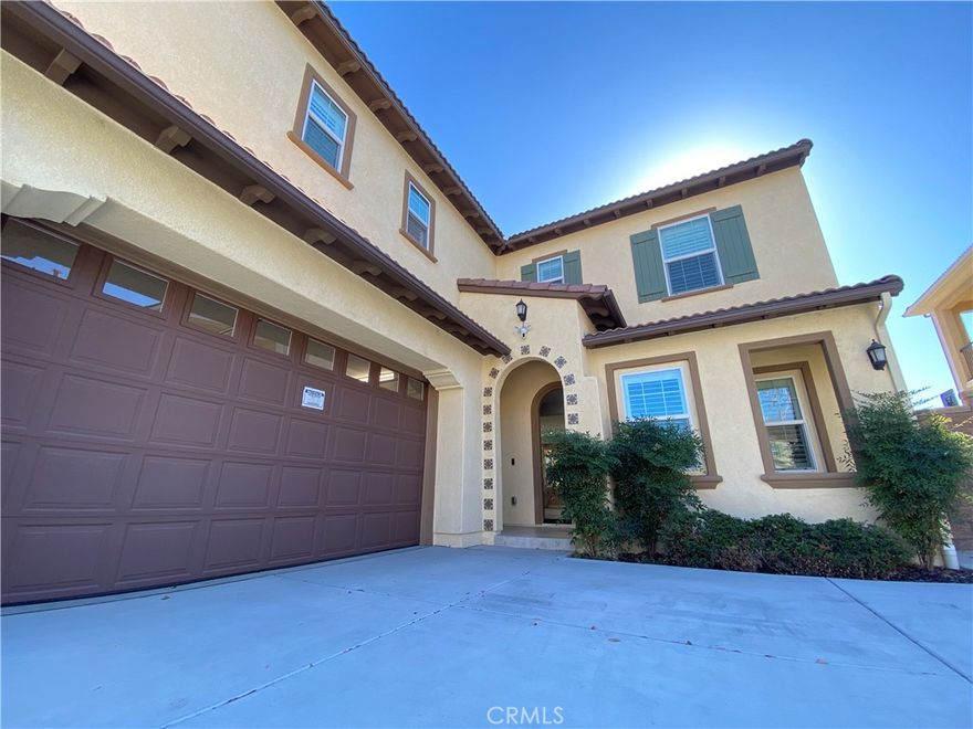 Welcome to this splendid residence nestled in the highly coveted Borba Villas community in Chino Hills. This unique home boasts a flexible layout, initially crafted as a Next-Gen design, offering the option of one bedroom and a living area on the ground floor, each accessible independently or combined as two bedrooms. Built in 2018, this impressive home showcases five bedrooms, 3.5 bathrooms, including a luxurious master suite and two inviting guest bedrooms on the upper level, along with a generously-sized loft space. The first floor boasts a gourmet kitchen adorned with granite countertops and a spacious center island. Expansive stackable sliding doors open up to the inviting California Room, seamlessly merging indoor and outdoor spaces. The backyard, generously proportioned and south-facing, bathes in abundant sunshine, creating an ideal setting for gatherings and leisure with loved ones. The master suite offers the indulgence of his and her sinks, ample counter space, a generously-sized glass shower, and a lavish soaking tub, inviting relaxation after a busy day. Positioned within an exceptional school district, this home is surrounded by a wealth of shopping destinations, entertainment options, and picturesque parks. Notably, the city itself holds the distinction of being ranked the sixth safest city in the United States.