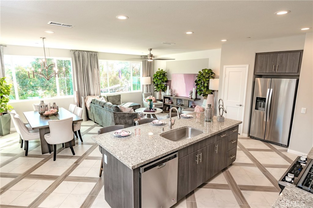 Beautiful BRAND NEW two story Townhome located in the prestigious Wood Ranch master planned community. A former model, This 3 bedroom 2.5 bath luxury townhome is 1714 sq ft and sits at top a hill with mountain views. Model home upgrades from top to bottom! The first floor is inviting, light and bright with. This floor plan's first level includes a living room, dinning room, kitchen and powder bathroom downstairs. The upstairs includes a ample Master bedroom with walk-in closet, Master bathroom with separate tub and shower and dual vanity with quartz countertops. The laundry room and linen walk-in closet are both generous in size. The kitchen boasts upgraded cabinets, stainless steel appliances and single bowl sink, recessed lighting, prewire for fans and much more! The common area amenities include a pool, spa and restroom facilities. This new construction townhome is ready for move-in!