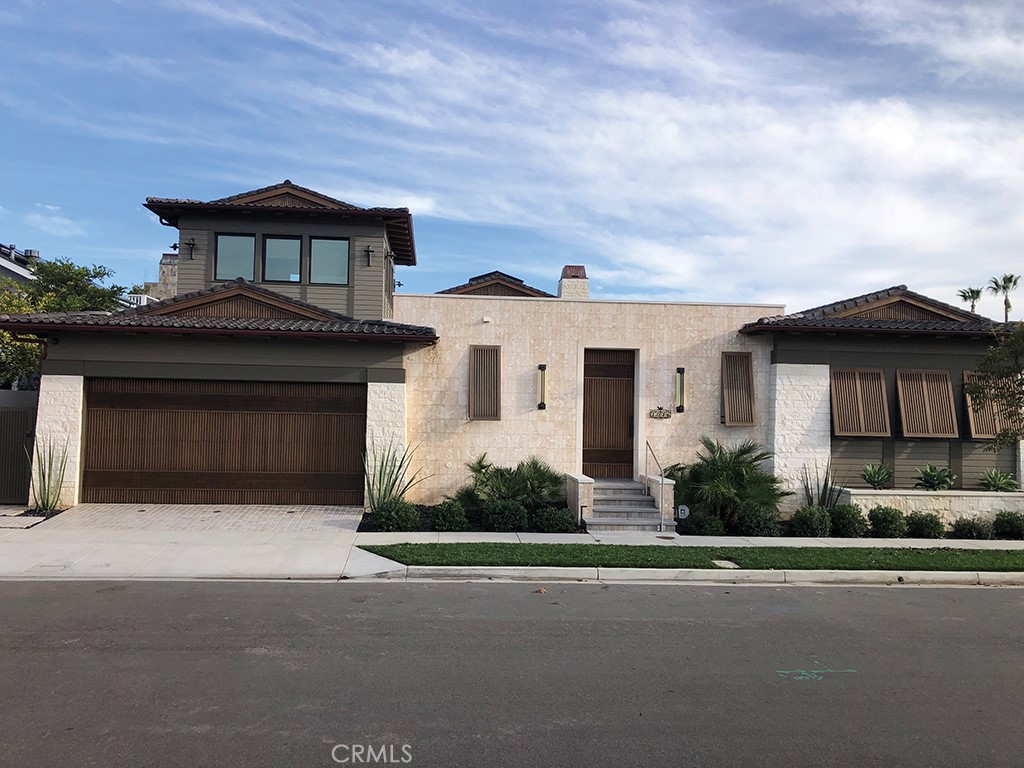 Welcome to 1076 Pescador Drive, a four bedroom, four-and-one-half bath single-family masterpiece. This stunning architectural gem designed by noted architect Chris Light features a three-car garage and the highest quality materials in approximately 3,988 square feet. As you enter, you are greeted with a very cool water feature consisting of large rectangular slabs in a pond which takes you from slab to slab to the primary entry. Enter into a large great room with cathedral ceilings and a magnificent fireplace. The great room is surrounded by windows at ceiling height, providing natural light and a beautiful design element. The great room with it's separate wet bar and ice maker is open to the open-concept kitchen with its large island and top-of-the-line appliances, including a built-in SubZero refrigerator, SubZero wine cooler and a built-in SubZero freezer. There is a coffee bar with a top of the line Miele Coffee Machine, and a two drawer below counter refrigerator. The living space, including the master bedroom and guest bedrooms is all on the lower level, which showcases panoramic views of Fashion Island® and its night lights, Saddleback Mountain, the yachts in the channels below and the ocean on a clear day. The second level is primarily a very large deck dedicated to enjoying all the great views noted above, and is the location of a unique, large, freestanding room with a TV and wet bar, which could be a retreat, office, playroom, theater, cigar room, or any number of possible uses. All surfaces are natural stone and solid wood, and all choices of materials were based on the highest quality. There are too many amazing features to note. A high-end washer and dryer are included. This is not only a dynamite residence; it is a true work of art.