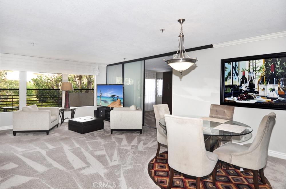 Gorgeously upgraded one bedroom plus den Newport Beach condo. Top of the line improvements which include: Travertine flooring, cherry wood cabinets, stainless steel appliances, granite countertops, crown molding, and custom built-ins. Not to mention you couldn't ask for a better gated community with 2 pools, spa, clubhouse, state of the art fitness room, and tennis courts. Close to the beach, fine dining establishments, and shopping!