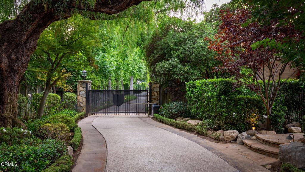 A rare, Linda Vista gem sitting prominently, 'front row center' with a panoramic views of the perfect combination of the iconic Rose Bowl, the Brookside Golf course and the majestic San Gabriel mountains. Don't be mistaken, properties like these don't come around very often in Pasadena. There are only a select few with this perfect view, large lot size, and extremely private location. This is 'Waterfront Pasadena'.Now let's talk about the house. Think, Father of the Bride meets Wisteria Lane. This home speaks togetherness, gatherings, warmth, charm, and entertainment. A permanent 'staycation'.The long, gated private driveway passes the separate secluded permitted ADU/guest house. It is a 730 sqft sanctuary complete with a kitchen, bathroom, bedroom, and disappearing accordion windows that turn it into a fun poolside entertainment paradise. It is a compound perfect for adults, kids and teenagers. The pool and spa are centered on the lot with a covered veranda & sleek fireplace overlooking the putting green. Attached on the other side of the guest house is a complete outdoor grilling kitchen-- complete with built in barbecue, ceiling fans and heaters. This backyard #1- is the perfect entertaining area-- far enough away from the main house to offer privacy-- but still behind the gates of your estate. The drive in is lined with a canopy of trees that bloom pink and white and continues to a three-car garage, replica playhouse, and the main house~ where it all comes together.A welcoming foyer with exposed beams and a dramatic fireplace graces the entrance and leads to the elegant step-down living room with a stunning view, centered fireplace, and hardwood flooring.The great-room entertainer kitchen that connects the casual family dining area and the formal dining room is light, open, functional, and spacious.A south wing, lined with three bedrooms & two bathrooms, one of them being a spacious main floor suite is quiet and a peaceful part of the home.A demi flight of stairs leads to the secluded, tree-top, primary bedroom suite with an office/den, a fireplace, nice mountain views, and a beautiful veranda overlooking the pool and grounds. Last but not least, the rear yard--backyard #2 is a special spot with 2 majestic old oaks keeping watch over the grassy yard, rose garden, and patio with a stone fireplace. This is a magical, once-in-a-lifetime home.