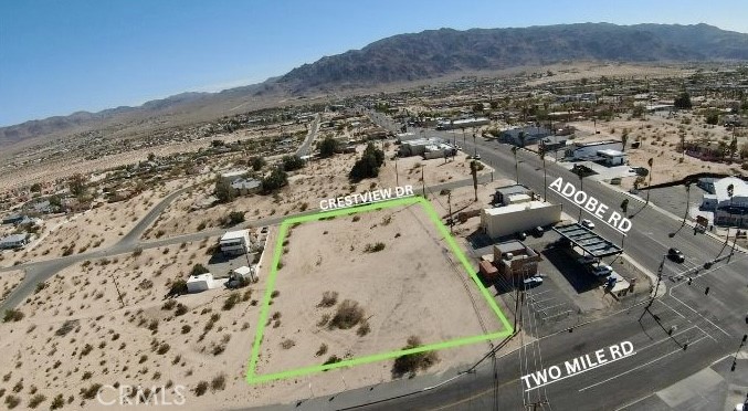 One of a kind Commercial Lot in High-Traffic Area – Just Under 1.1 Acres with water and power in the street!
Opportunity awaits with this versatile and uniquely positioned lot located in one of the most desirable areas of 29 Palms. Zoned General Commercial (GC) and spanning just under 1.1 acres, this parcel offers endless potential for your next business venture or investment project.
What sets this property apart is its dual street access – the lot fronts both a paved section of 2 Mile Road and has rear access to another paved street, offering flexible entry points and exceptional visibility. Its location is unbeatable: just minutes from downtown 29 Palms, close to Adobe Rd, near the Marine Corps Base, and surrounded by a growing number of local businesses. With water and electricity appearing to be in the street, this lot is a blank canvas ready for your entrepreneurial vision. Whether you're looking to build retail, office space, or a mixed-use project, this is your chance to make your mark in a thriving desert community. Don't miss this rare opportunity to own a piece of prime real estate in a high-demand area!
Buyer to verify access to all utilities and all lot lines are approximations.