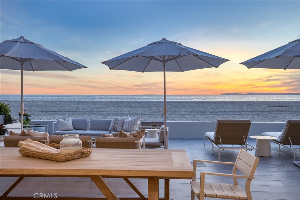 Introducing a masterpiece of coastal Newport Beach living, this luxury oceanfront property stands as a testament to modern elegance and meticulous craftsmanship. Newly built from the ground up, every detail of this home exudes sophisticated relaxation. Upon entry, guests are greeted by a seamless fusion of indoor-outdoor living, courtesy of Fleetwood windows and La Cantina doors that frame breathtaking views of the Pacific Ocean. The extra-large oceanfront patio invites relaxation around a cozy fire pit, perfectly positioned to enjoy the sound of waves crashing against the shore, while an expanded rooftop top deck offers panoramic views of the coastline, ideal for basking in the beauty of the sunset or entertaining guests. A sizable, fully covered California room allows an elegant setting with a dining table and seating for 12, providing a memorable setting for meals with family and friends. No expense was spared in the creation of this residence, complemented by high-tech amenities including Lutron and Control Four systems for seamless control of lighting, climate, and security. An integrated AV system with built-in speakers offers the ultimate audiovisual experience for gatherings or quiet nights in. The user-friendly floor plan complete with a fully permitted basement providing additional living or an entertaining space, comprises 4 bedrooms; a primary bedroom suite with generous balcony deck, spa-like bath with wet room shower and bathtub, an en suite guest bedroom and bath, two additional bedrooms and laundry on both levels. Designed by the esteemed Julie Hawkins of Hawkins interiors in Napa, every corner of this residence reflects her signature style of refined luxury and timeless sophistication. Experience the epitome of coastal living in Newport Beach at this extraordinary oceanfront retreat, where every detail has been thoughtfully considered to offer the ultimate in luxury and relaxation.