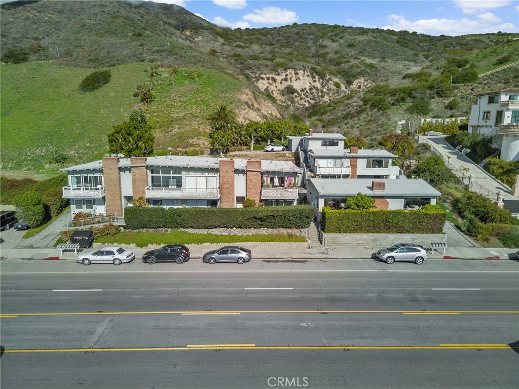 Trust Sale - First time on market in 40+ years. Rare opportunity to own multifamily in the heart of Malibu across from the famous Carbon Beach "Billionaires Beach" section of Malibu. 13 units, 3 buildings on almost an acre. A redevelopment opportunity or value add opportunity. Proforma income estimated to be 150% higher than existing gross income. A stones throw from the famous Malibu Pier, close to the Country Mart shopping center and right across the street is the beach access through the some of the most valuable oceanfront properties in California. One unit just remodeled. A 3 car garage may be a possible ADU conversion.
