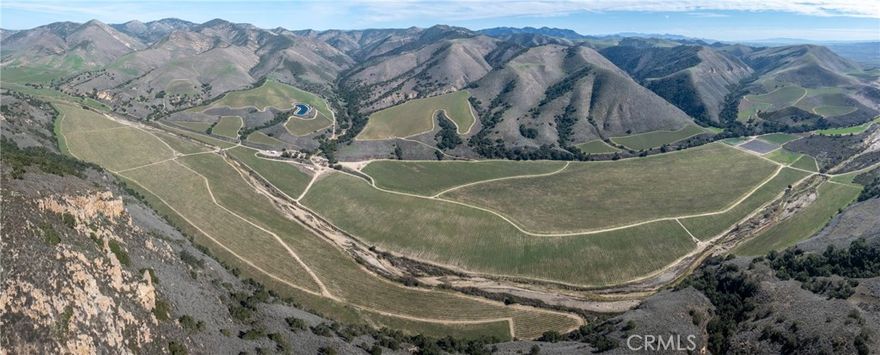 A vineyard of this caliber rarely comes to market. Developed by a world-renowned wine company for its ultra-premium brands, North Canyon Vineyard spans 1,672± acres in 2 parcels across San Luis Obispo and Santa Barbara counties in the heart of the Santa Maria Valley AVA.



Beyond its proven reputation for wine grape production, the property offers remarkable versatility for various high-value agricultural ventures. With ideal climate conditions, prime soil diversity, and reliable water resources, there is significant potential for conversion to high-value crops such as berries, leafy greens, and specialty vegetables, in addition to continued premium grape production.



With 919.8± planted acres of Pinot Noir, Chardonnay, and select white varietals, this top-tier estate sits in one of California’s most acclaimed winegrowing regions, where a unique transverse valley funnels cool Pacific breezes, extending hang time for optimal ripening. Positioned at elevations reaching 600 feet, the vineyard’s upper-bench shale rock soils produce world-class Pinot Noir, while the fertile valley floors yield high-quality Chardonnay, both commanding premium bottle prices.



Water security is a key asset, with six agricultural wells delivering 2,210± GPM, supplemented by natural water table recharge from the Twitchell Reservoir. With a history of excellence, a private and stunning setting, and a scale that supports long-term investment growth, North Canyon Vineyard is a legacy estate positioned for the future.



Wines sourced from this site have earned 90-96 point ratings, reinforcing its pedigree among the region’s most sought-after producers. 

The adjacent parcel is APN 090-422-005 (CRMLS Listing ID: NS25058918). The 2 parcels are available for purchase either separately or together.



Offering Package available upon request.
