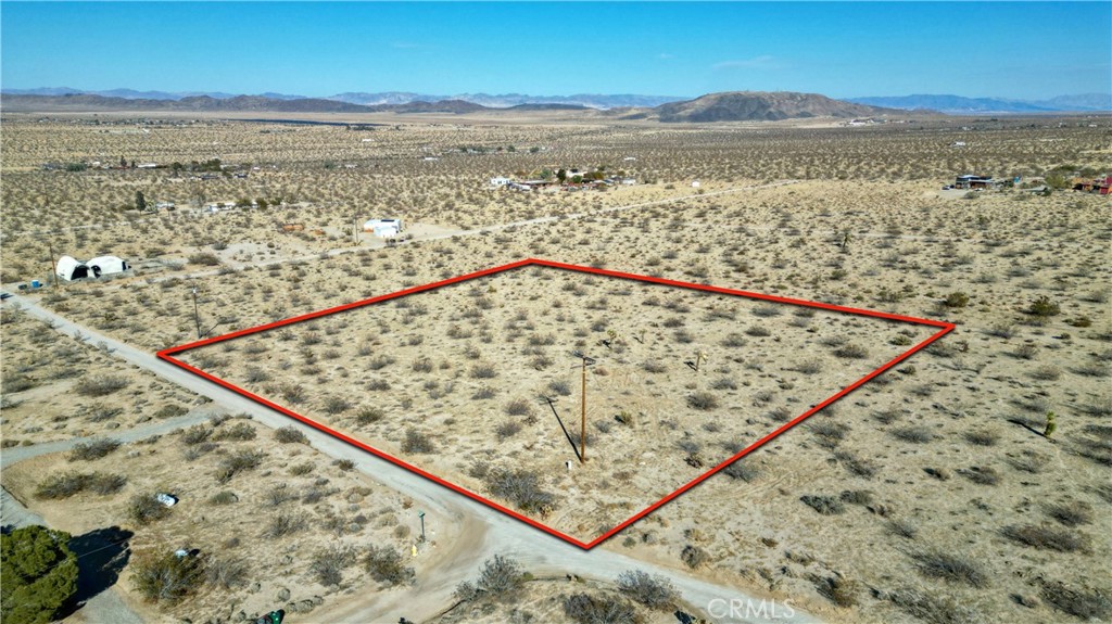 Here is a great opportunity to own two 1.25 acres in one of the most sought after areas of Joshua Tree. Power and water are in the street. Properties are being sold together. These properties are in walking distance from the Joshua Tree National Park. Priced to move. Come take a look!!!