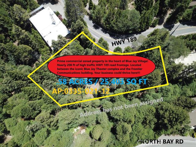 Prime commercial property in the heart of Blue Jay Village! Lush beautifully treed setting with High traffic HWY 189 road frontage located between the iconic Blue Jay Theater complex and the Frontier Communications building. With nearly 200 feet of Highway 189 road frontage for possible parking and a highly visible location, there are numerous potential commercial uses. Approx. 25403 square feet of total (over 1/2 acre) land in highly sought after Blue Jay Village. Owner may carry/finance with 50% down. Your business could thrive here, opportunity knocks!