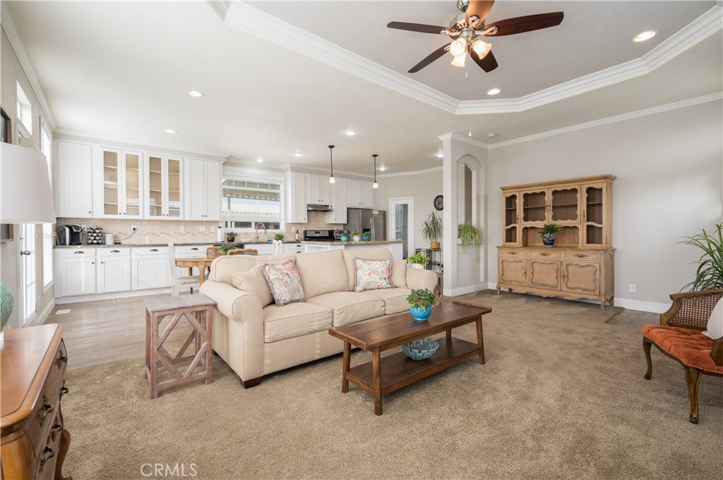 Light, bright, and beachy with FANTASTIC WATER VIEWS, in a rent control park! No need to update this like-new 2015 built, 3 bedroom, 2 bath home. Vinyl wood flooring, granite and formica countertops, a walk-in pantry, recessed lighting, and a custom-poured concrete ramp are just a few of the perks. Sip your morning coffee while soaking up the beautiful water views from your back porch. Whisk up some treats with stainless steel appliances, ample counterspace, and the oversized island in the large, open kitchen. The high ceilings and open, airy floorplan fills the home with natural light. With rent control, great amenities and water views you can affordably enjoy the beach life! Price just reduced by $10,000!