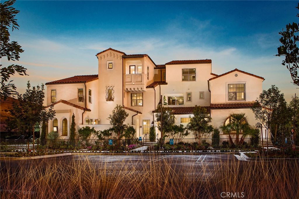 Brand New Brisa plan 1B home is being completed for Fall 2018 move-in. Desirable Portola Springs location and access to community parks, pools and walking trails. This bright and sunny home includes lots of windows for light and fresh air. Kitchen includes white Thermofoil cabinetry with upgraded Clay Pebble Quartz Countertops with full tile splash and Island seating. Appliances: Bertazzoni Stainless Steel free standing range and upgraded hood, Bosch microwave drawer and dishwasher. Private deck located off of the dining room for casual entertaining. Secluded Powder Bath includes pedestal sink and mirror. Two spacious private bedrooms with en-suite baths on the upper level are great for both families and singles. Custom tile detail at master bath vanity splash and shower. Additional LED recessed lighting included in the Living Room and all bedrooms. Home includes builder standard flooring materials at no additional charge or buyer may select upgraded flooring materials at builder's Design Center at an additional cost. Custom paint on interior walls in Vista Desert Palm, laundry area on bedroom level. Two car side by side garage with direct access. This beautifully appointed home includes thoughtfully selected options and upgrades . Primary photo is of the Brisa model homes and interior photos are of the Brisa plan 1 model home.