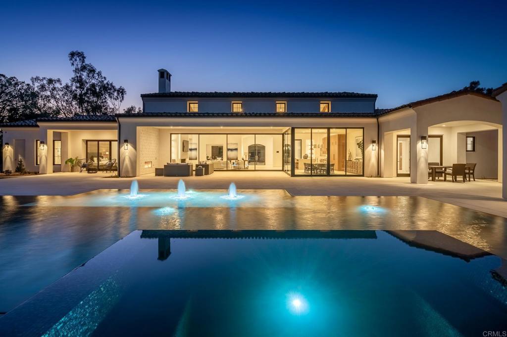 Stunning Brand New Construction 2021. You will be immediately enthralled as you approach the front door over a seamless waterway. An impressive great room boasts a 50 foot opening that disappears into the wall and joins indoor/outdoor living. The dining room offers seamless glass Temperature Controlled Wine Wall and the gourmet kitchen offers top of the line appliances with modern Italian cabinets plus Full Back Kitchen. The all One Level living embraces the SoCal lifestyle with 5 bedrooms, Office, Detached Guest Home on an amazing 2.5 acre Park-Like setting!