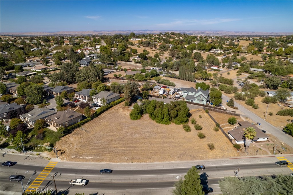 Attention Developers and Investors! A rare find inside the city limits of Paso Robles to possibly develop 5 units in total, consisting of one triplex and one duplex right in the heart of the Creston Corridor. This well located parcel is situated on +/- .9 acre. As per the seller, this parcel had received entitlement from the city with permits prepared and ready to be paid for by the new buyer (subject to additional conditions) for the property buildout. Seller has spent over 2 years on planning, designing, revisions, attending public hearings and readying plans with local engineers and an architect. The plans for this property illustrate each unit consisting of +/- 1248sqft, 3 bdrm/2ba with an open concept design. Additional amenities noted on the plans include kitchens offering an island, walk-in pantry, indoor laundry room, storage & balcony that may provide an additional +/- 300ft of storage space. The floor plan renderings offer a dramatically chic and upscale vibe utilizing wood, glass & metal finish. Located near grocery stores, schools, dining and historical downtown Paso Robles. Ask your agent for a property info packet that includes more detailed information. Permitted status has expired and Buyer will need to resubmit for reinstatement.