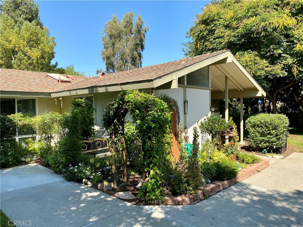 Enchant your senses at this inviting La Corona single level home with timeless appeal. Marvel at its spacious naturally lit rooms and beautiful enduring rich wood like laminate flooring and cathedral ceilings. You will want to linger in the dramatic open living room with wide open views of the lush foliage and quaint gardens. Wonderful Location in popular area of the Village. Enjoy the serenity of the park like setting embracing this home. Upgrades include new flooring, new dual pane windows & sliders, washer & dryer, remodeled Kitchen with custom designer accents. Skylights fill this cozy home with an abundance of natural light. This beautifully crafted opportunity awaits your arrival for your new lifestyle in the fabulous resort style living in Laguna Woods Village. Large private balcony is a wonderful place to enjoy the view. Enjoy all the amenities of the active senior community of Laguna Woods. Golf, tennis, art studio, gardens, library, pools, over 250 clubs to enjoy! And only 8 miles to beautiful Laguna Beach.