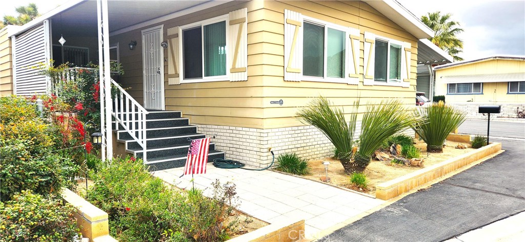 Country Club Mobile Homes Estates is a 55-plus park. This spacious mobile home offers very comfortable living with two large bedrooms. Ample living space and dining area. This is a beautiful corner lot with views of the mountains. Enjoy the large, spacious kitchen with two pantries. Numerous cupboards offer plenty of storage for all of your kitchen needs. The main bedroom has two large closets and one walk-in closet. The second bedroom has a pop-out area, giving plenty of extra bedroom space, office space, an art studio, or a workout area. There are energy-efficient double-paned windows. Two porches offer a perfect spot for relaxation. The added Tuff Shed is clean with shelving and electricity. Enjoy time at the pool and clubhouse. It is within walking distance to Hawks Landing Golf Course and The Roost Cafe. Furnishings are negotiable.