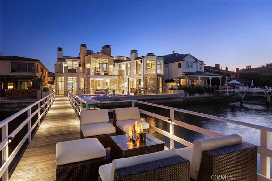 One of the most extraordinary homes on the bayfront, this newly constructed masterpiece is ideally positioned at the mouth of Newport Harbor and designed with the utmost quality of craftsmanship and material. Modern Farmhouse in style with French limestone, Riviera Bronze windows and wood beamed ceilings, the property is fitted with custom finishes and cutting-edge technologies throughout – Lutron lighting with Savant Smart Home Automation, custom variable depth pool with buoyancy lift, 2,000+ sq. ft. subterranean garage with turnstile, just to name a few. The nearly 10,000 sq. ft. residence, fashioned with a 400-year old reclaimed beam stairwell, features six bedrooms and ten bathrooms including separate guest quarters with private access, a great room with Cypress paneled entertainer’s kitchen, wine room & bar, master bedroom with adjoining screening room, gentlemen’s loft and private office with 270-degree bay views. The subterranean level, cleverly designed with loads of natural light, is dedicated to spa amenities – salt cave, hydrotherapy, Swedish dry sauna, gym, rock climbing wall, laundry room and juice bar. Private docks can accommodate up to 59’ and 80' vessels plus room for a small third. At the Balboa House, look no further for the ultimate in Newport Beach luxury living.