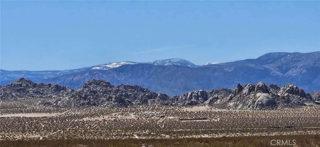 Surround yourself with stunning mountain views on this 2.21-acre parcel in Lucerne Valley! With level land and wide-open space, this lot is perfect for a peaceful getaway, off-grid living, or an investment opportunity. Enjoy breathtaking sunrises and star-filled nights in this tranquil desert setting. Drive by today and check it out for yourself! APN: 0448-201-04-0000. Latitude:34.527983, Longitude:-116.778761.