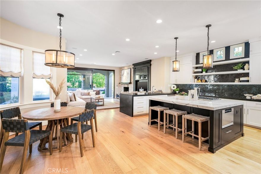 Welcome to 24 Seabluff, an exquisite coastal beauty nestled in the prestigious 24 hour guard-gated neighborhood of Bonita Canyon. This spectacular residence is positioned on an expansive 4,000 square feet situated on an almost 11,000 square foot corner trophy lot. Boasting 5 sizable bedrooms (one main floor bedroom), 4 upstairs spacious bedrooms, all with en-suite bathrooms and walk-in closets; this spectacular luxury residence offers unparalleled space and comfort.  The outdoor space is beyond dazzling, offering one of the most impressive and private exterior enclaves in Newport Beach.  Featuring a pool/spa (with automatic safety cover), outdoor shower, dual fire pit seating areas, and countless more entertaining spaces to enjoy your outdoor private sanctuary. As you approach this stunning and charming residence, you are immediately captivated by the stunning tree-lined streets where East Coast charm meets Newport Beach coastal living. Every detail of this home has been carefully crafted and executed with high-end luxury finishes and designer touches. Countless upgrades include designer kitchen with marble countertops, high-end Viking appliances and Subzero refrigerator, custom wallpaper & paint, dazzling chandeliers and lighting throughout, dual HVAC, tankless water heater, endless outdoor entertainment spaces; including built-in BBQ & fridge as well as an impressive pool/spa with outdoor shower.  Situated in highly coveted Newport Beach, 24 Seabluff offers a quintessential coastal lifestyle central to countless amazing beaches, world-class dining and shopping options, top-ranked schools, an array of outdoor recreational activities, and is also central to both the 405 & 73 freeways. Don't miss your opportunity to view and own this extraordinary luxury Newport Beach residence today.