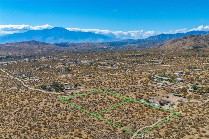 Prime Development Opportunity in Morongo Valley - 5 Acres with Stunning Views! Discover the perfect investment in Morongo Valley with this unique offering of two separate, adjacent 2.5-acre lots, totaling an expansive 5-acre property. Situated in a highly sought-after area with sweeping mountain and valley views, this property is ready for your vision. Utilities appear to be in the immediate vicinity, making the development process even more convenient. With endless potential, these lots are ideal for development. Nestled close to scenic hiking trails, popular shops, and charming restaurants, you’ll also enjoy easy access to both Palm Springs and Joshua Tree National Park, making it a prime location for a serene retreat or luxury residences. Potential to build a house and an ADU on each lot, totaling 4 homes! Don’t miss this rare chance to create something extraordinary in the heart of the High Desert. Secure this 5-acre gem and bring your dreams to life!