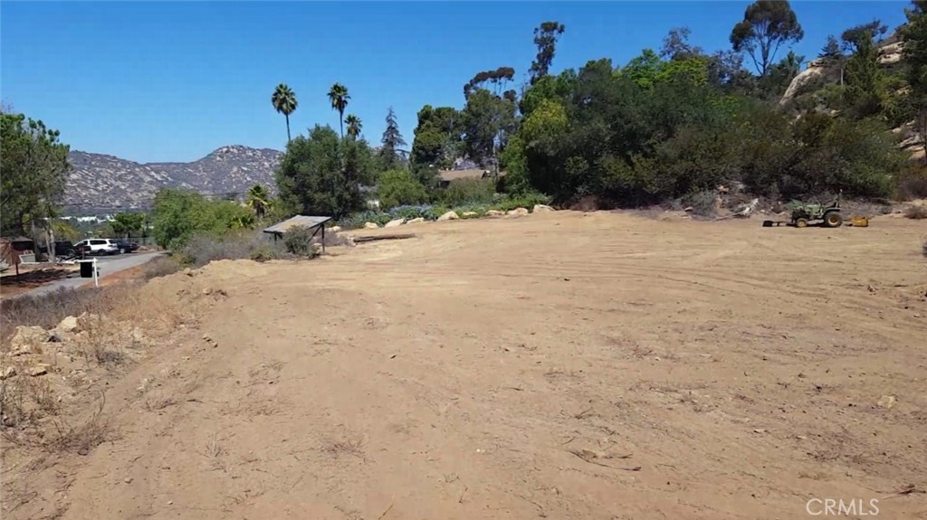 Stunning 2.33-Acre Lot with Panoramic Views – Ready to Build! Nestled among custom homes on a paved road, this exceptional 2.33-acre parcel offers the perfect setting for your dream home. Enjoy breathtaking pastoral views, and on a clear day, catch a glimpse of the Pacific Ocean shimmering in the distance. The location strikes the perfect balance between peaceful rural living and convenient access to key destinations: • I-15 On-ramp – just 3 miles away • Temecula & Award-Winning Wineries – 5 miles • Premier Resorts & Local Gaming – 7 miles • Escondido – 24 miles • San Diego – 53 miles. The owner has invested thousands in completing a PercTest, site plans and Engineer Report for placing a 3 bedroom Manufactured home on the property (reports available for review). The property is well-equipped for development, featuring an installed water meter, electricity approximately 100 feet away, and a fire hydrant within 1,000 feet for added safety. Don’t miss this incredible opportunity to build in a prime location with stunning views. Call today for more details!