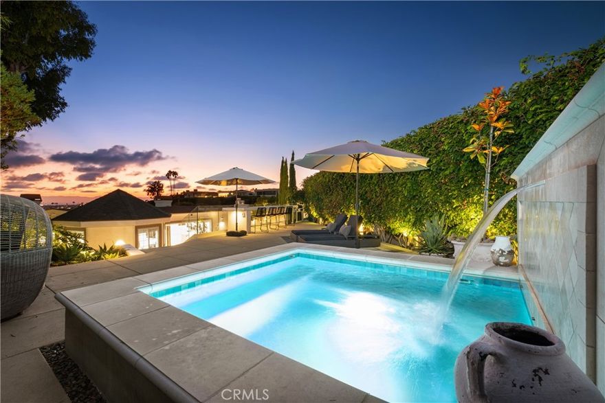 Located in Corona Del Mar's coveted coastal enclave of Irvine Terrace, within walking distance to the Newport harbor, Yacht clubs, NB Country Club, CDM village, Ocean Blvd, beaches, Fine dining and shopping at famed Fashion Island and more. The exquisite Contemporary designed home exemplifies indoor /outdoor living at its best with breathtaking views of the ocean, bay, sunsets ,lights and multiple al fresco dining experiences! The private 10,395 SF lot is one of a handful in Irvine Terrace which backs to the park. The completely refreshed turn key home encompasses 3000'+ of living space, 3 bedrooms & 3 baths plus a private office, open to the livings areas, the chefs kitchen appointed with high end appliances, Carrera marble counters double ovens, ice maker, wine fridge and built in fridge .Some features include, Control 4 and Sonos , Martin Logan ceiling speakers, cameras, ring , entire home water purification / softener, dual electric car charging stations , NEW insulated roof with 10 year warranty , tankless water heater, LED lighting, French Oak 10" wide Warren Christopher floors throughout  The well appointed primary suite dressed with a double walk in closet , Carrera full slabs on bath walls, solid oak vanities, towel warming racks and designer fixtures. The very private outdoor spaces include an oversized private spa with fountain , gas fire pit with built in seating, 15 foot plus waterfall edge bar top with panoramic ocean views located on an elevated deck , surround sound , an outdoor kitchen fit to satisfy any BBQ master with a 42” Twin Eagles grill, wet bar, fridges, warming drawers, trash, ice maker, marble counters and prep station and your private enchanted garden delivering an unparalleled dining experience! Enjoy direct access to Irvine Terrace park and all its amenities. The location of this home can not be matched!