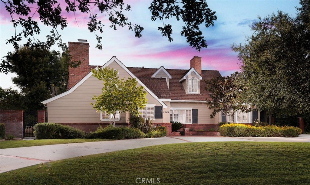 Step into this cozy Cape Cod-style residence, nestled in the highly sought-after Huntington Library area of San Marino. With 5,082 sqft, this home features three spacious bedrooms upstairs and two downstairs, providing a well-balanced and versatile living space.
Situated on a 21,600 sqft lot—nearly half an acre—the backyard, complete with a pool and spa, is an idyllic setting for family gatherings and countless adventures for the kids. As you enter, a welcoming office to the left offers a serene space for working from home, complemented by plantation shutters that invite ample natural sunlight.
The living room exudes charm with its granite fireplace and a large window that frames the front yard. Adjacent to this, the elegant formal dining room, adorned with a shuttered bay window, connects to the gourmet kitchen. The kitchen featuring a beautiful center island with an abundance of storage including a walk-in pantry, granite countertops, and a light-filled breakfast area, the kitchen sets the stage for culinary delights.
Flowing effortlessly from the kitchen, the spacious family room features a wet bar and windows that overlook and open to the backyard. With a sense of seclusion and ample privacy, this property stands as an inviting haven for those seeking a residence that combines elegance, functionality, and a retreat-like atmosphere.
