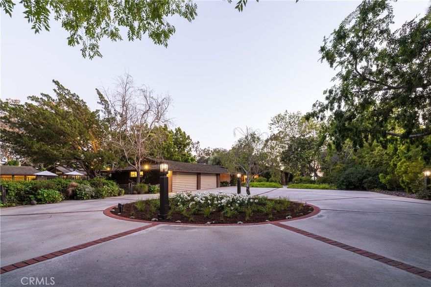 Nestled atop the serene bluff overlooking Newport Harbor's Back Bay, 2600 Mesa Drive presents a rare gem in Newport Beach - one of the largest residential lots in the city. This sprawling estate covers over 3.5 acres of meticulously landscaped grounds, offering unparalleled privacy and spectacular  views of the entire Back Bay. The property features a single-level ranch home, spanning nearly 7,000 square feet of elegant living space, which has had the honor of hosting numerous presidents, vice presidents, governors, and other dignitaries, adding a rich historical layer to its allure. Designed with meticulous attention to detail, the home boasts 6 bedrooms and 8 bathrooms, offering ample space for luxury living and grand-scale entertaining. A testament to thoughtful design, the residence is positioned to capture the breathtaking morning sunrises from the east and the mesmerizing sunsets in the west. With 381 feet of view frontage, residents can enjoy panoramic vistas of the water, making every moment at home a picturesque experience. The estate's outdoor amenities are equally impressive, featuring a tennis court, a pool house, and a sparkling swimming pool, all designed to provide unparalleled outdoor living experiences. The property is zoned equestrian and is permitted stabling up to six horses. The property's architecture and layout were carefully planned to blend seamlessly with its natural surroundings, ensuring that each day is greeted with the sun's warming rays and concludes with a stunning display of color over the water. This exceptional estate offers a unique opportunity to own a one-of-a-kind piece of paradise in Newport Beach, where luxury meets natural beauty in perfect harmony, enriched by its legacy of distinguished guests.