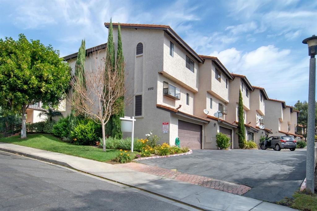 Beautiful La Costa townhome with laminate wood flooring on main floors and carpeting in bedroom areas. Enter into a cozy living room featuring a gas fireplace and French doors leading to an outside patio. Gaze up to dining room through a wood railing giving you that "great room" feeling. In the dining area there is a wall of storage with plenty of room to serve buffet style. Open to the kitchen there is a new refrigerator and dishwasher, abundance of cabinetry and a garden window to grow your herbs. Neighborhoods: La Costa Other Fees: 0 Sewer: Sewer Connected Topography: GSL
