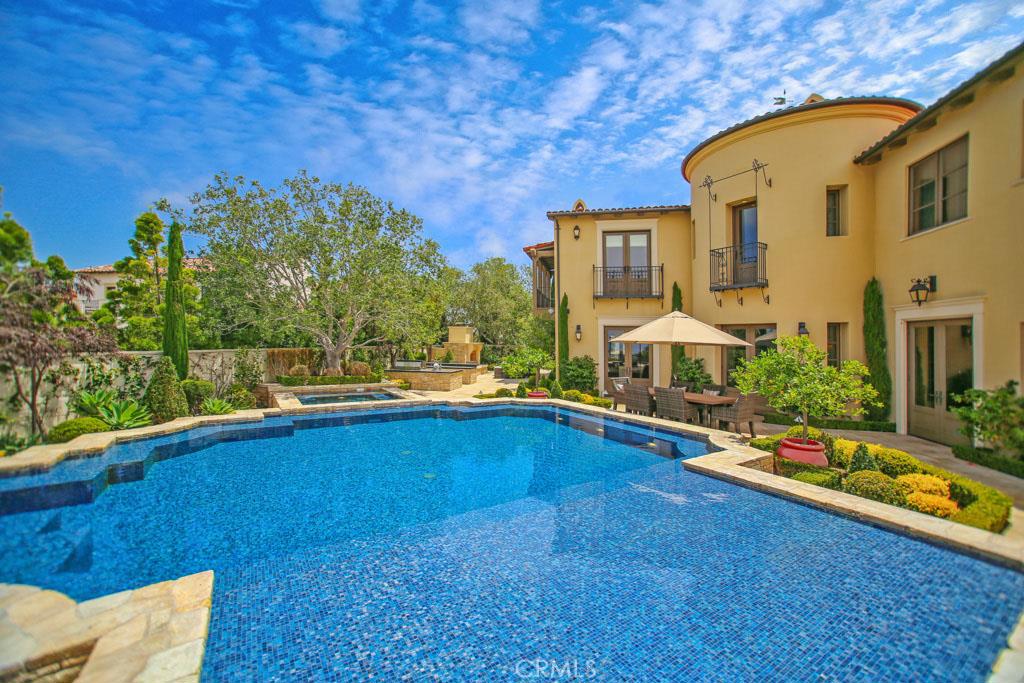 ATTENTION POTENTIAL NEW HOME PROJECT BUYERS!!..Avoid The Hassle of Interior and Exterior Improvements..Buy This One Turnkey! Panoramic Ocean view home! Exclusive neighborhood of Crystal Cove, Newport Coast. This magnificent estate has breathtaking views of the Ocean, Catalina Island, City lights and Palos Verde's. Home features 5 bedrooms, including dual masters, one downstairs and a larger master suite upstairs. The expansive master walk-in closet was professionally designed to showcase the collections of the most discriminating shoppers, and includes a custom center island with built-in television. Main level encompasses a library/office, formal living room, formal dining room, gourmet kitchen with breakfast area, and open family room. The gourmet kitchen comes complete with high-end Wolf Appliances and Walker Zenger finishes. The outdoor entertaining area is fit with a custom fireplace, private BBQ, in-ground spa and an incredible infinity pool. Sophisticated appointments include hardwood flooring, wine cellar with cigar humidifier, audio visual system throughout, security system and central vacuum. Enjoy the world-class amenities of Crystal Cove, including 24-hour guard gate, swimming pool, fitness and tennis facilities, playgrounds, and access to the region’s best schools and Crystal Cove State Park. ASK ABOUT OWNER FINANCING Or Part Payment in China OK !