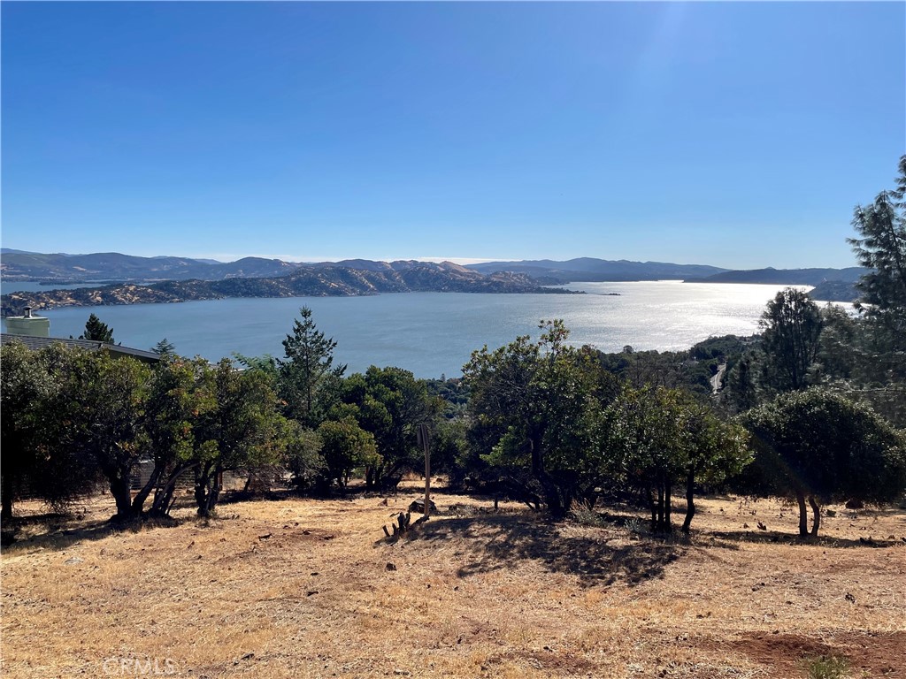 Amazing lake views on this over 1 acre lot in the desirable Riviera West community. This large lot is comprised of 4 parcels which are in the process of being merged. Water connection is in place, large pine tree on property has been approved for removal, and a fire hydrant is curbside. Perculation test on file. Lot has been cleared for fire prevention as Riviera West is a "firewise" community. The HOA includes pool, clubhouse, picnic area, and boat launch ramp for day use. Come make this large lot into your dream home.