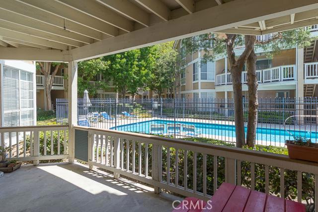 One of the best locations in this well maintained gated community. Spacious open floor plan with High ceiling. Custom tile floors throughout. A very large and inviting kitchen with plenty of counter space. Kitchen with gas range, dishwasher, microwave and refrigerator is included (no warranties.) Master Bedroom with dressing area and plenty of closet space. All closets doors are mirrored. Dual sinks in master bath. Huge Patio with pool view is just perfect for entertaining. Extra storage in the garage.