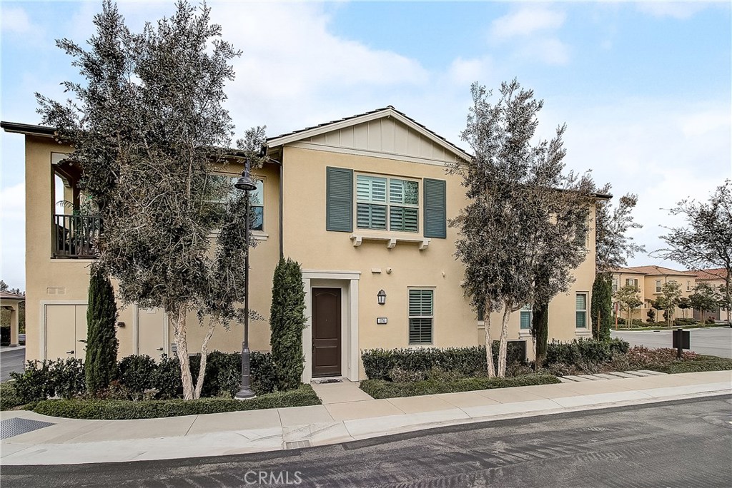 Welcome to 174 Rose Arch, an ideally located 2-story corner unit in Cypress Village! With almost 1,300 sq.ft of living space, this spacious 2 bedroom, 2 bath condo features gorgeous laminate floors and plantation shutters throughout. All living space is upstairs, with an open floor plan and high ceilings with crown moldings and recessed lights. Upgraded kitchen features sleek white cabinets, granite countertops, subway tile backsplash, and stainless steel appliances. Large breakfast bar opens to the dining & living area with access to your spacious balcony overlooking the beautiful neighborhood. Master suite features recessed lighting, en suite bathroom with walk-in closet, spacious shower and dual sinks. Convenient stackable indoor laundry in the hallway, and direct access to 2-car (side by side, NOT tandem) garage down below. Cypress Village residents enjoy many recreational activities and amenities, including 3 swimming pools, many parks, various BBQ & Picnic areas, basketball court, soccer field, tot lots and more! Both Cypress Village Elementary & Jeffrey Trail middle schools are nearby in the neighborhood, and easy access to 5 freeway.