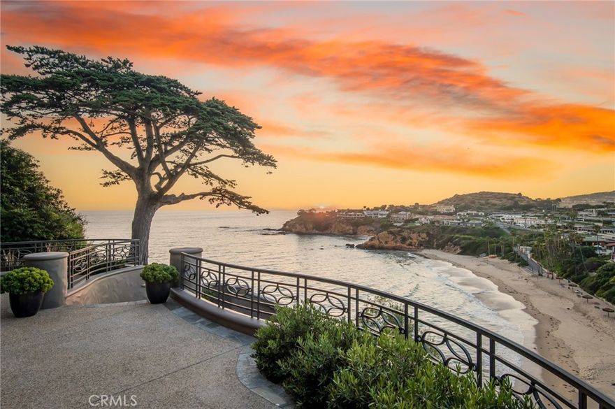 Perched atop a cliff in the prestigious enclave of Emerald Bay, this extraordinary estate, among merely three with direct private access to the waters below at Irvine Cove, offers boundless vistas of the ocean, Catalina Island, Palos Verdes and roaring whitewater just beneath you. Designed with intention to capitalize on both, the ever-changing views & privacy from neighbors, this residence occupies one of the most expansive lots within Emerald Bay as well as the Coast with nearly 100’ of frontage.  Multiple terraces, mature landscaping, and a cove-facing hot tub were meticulously envisioned to maximize the natural slopes and endless views of crashing waves. A spectacular towering cypress greets you as you enter the estate while sea lions, dolphins, ospreys, yachts, and more entertain. A soft contemporary design intersects with functionality, resulting in inviting interiors that lend themselves to everyday living and entertaining. The different wings add privacy for family and guests. Soaring ceilings create voluminous spaces throughout the residence. Walls of glass opening to the terraces bring the Pacific Ocean and beyond indoors and it feels as if you’re sitting on top of the water. The muted palette of natural materials such as wood and limestone, curated to not compete with the coastal beauty, creates a soothing environment. Grand in scale, the main areas of the property as well as all bedrooms face outwards towards the multiple water-facing terraces. The owners’ suite spans nearly an entire level of the home, creating a private retreat with a spectacular view balcony. The rarity of this vastness while designed to optimize privacy from neighbors of this oceanfront estate cannot be overstated.