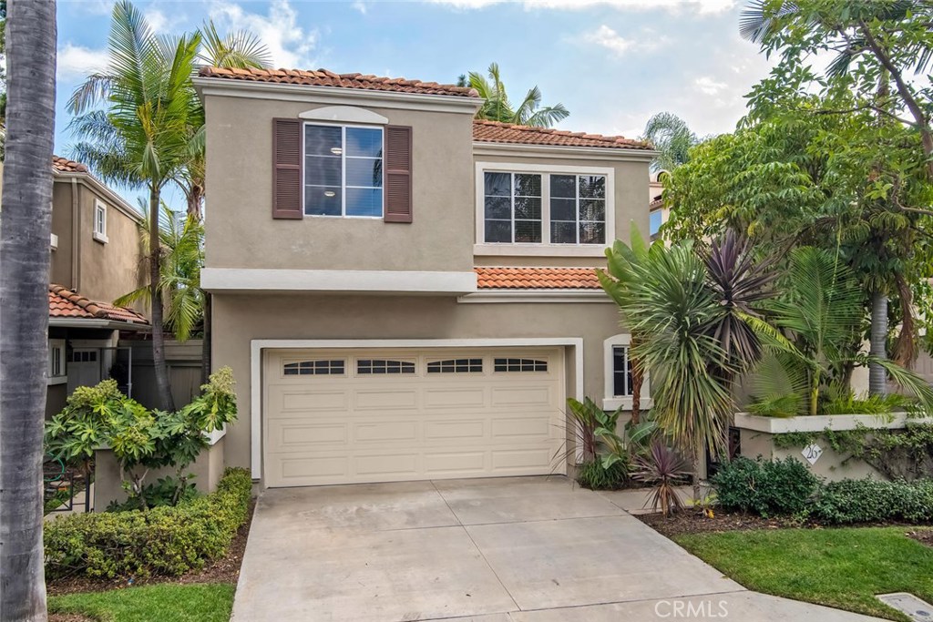 Beautifully nestled in one of Aliso Viejo's premiere communities, this gorgeous tropical style home is a welcoming oasis. This sophisticated 3 bedroom, 2.5 bathroom detached condo offers over 1950 square feet of living space, conveying calm from the moment you enter the court yard. As you make your way through an open concept floor-plan, you are greeted by a living room framed by a wall of windows and an elegant double sided fireplace that opens into a lovely dining area. The warm and inviting chef's kitchen features Alaskan White granite counter tops, stainless steel appliances and custom-stained dark cabinets which are enhanced by large garden windows that showcase an abundance of natural light into the home. Rest easily in your generously-sized master suite with high vaulted ceilings and sliding doors to a Juliet style balcony. Rejuvenate in a remodeled master bathroom with a custom designed shower and pebble stone flooring complimented by hand-chosen wave tiles. The two additional bedrooms are separated from the master by an over-sized loft that is perfect as a family room, home office or play room or can easily be converted into a 4th bedroom. Enjoy the influence of an island vibe throughout the back and side yards with incredible mature plants that create privacy. Other features include: remodeled powder room and upstairs bathroom, newer wood laminate flooring throughout and a well-sized garage with ample storage. Minutes to Aliso Town Center. Serenity awaits you!