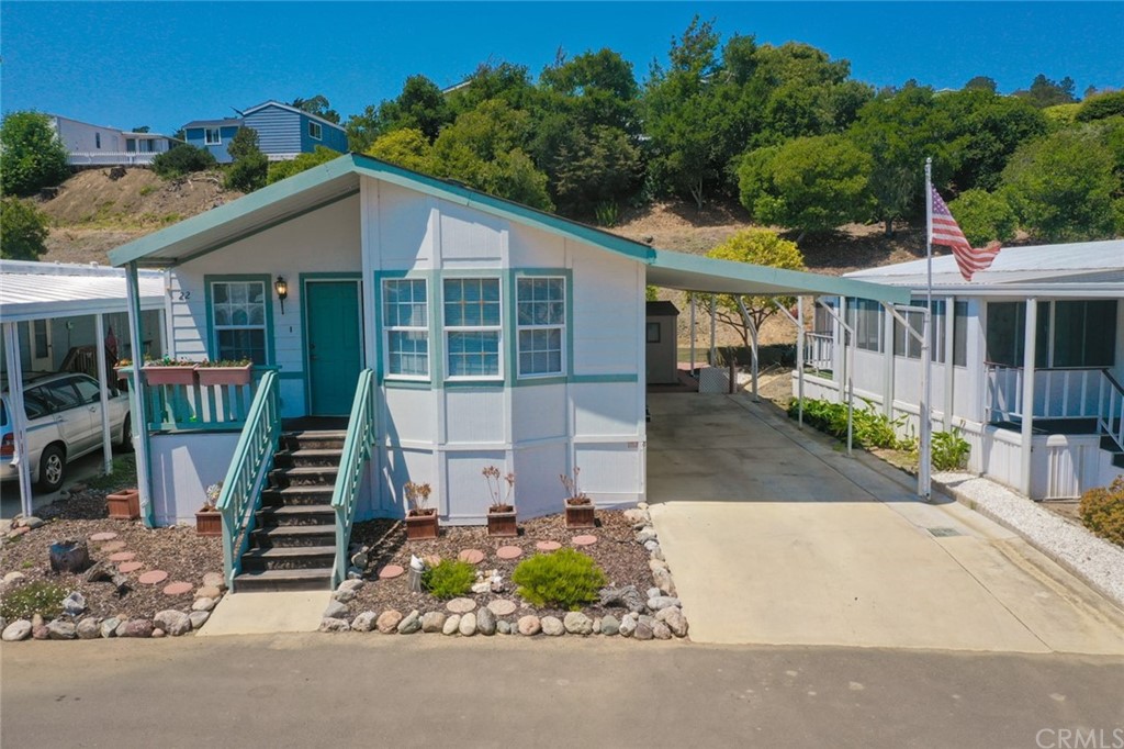 Double-Wide Manufactured Home in the Oak Terrace Mobile Home Park located in the center of Cambria. This 2000 unit is located on the lower level of the park. The 1,190 sf home features vaulted ceilings and a neutral color palette for a light, bright and airy feel. The kitchen has ample storage and dining space. There is a separate dining area as well, comfortable living room, 2 bedrooms including a Master with walk-in closet, 2 baths and indoor laundry. The two-car carport is wider than most and was completed with permits. The large shed toward the rear of the space has electricity and makes for a great workshop or storage. This is an age-restricted 55+ Park.