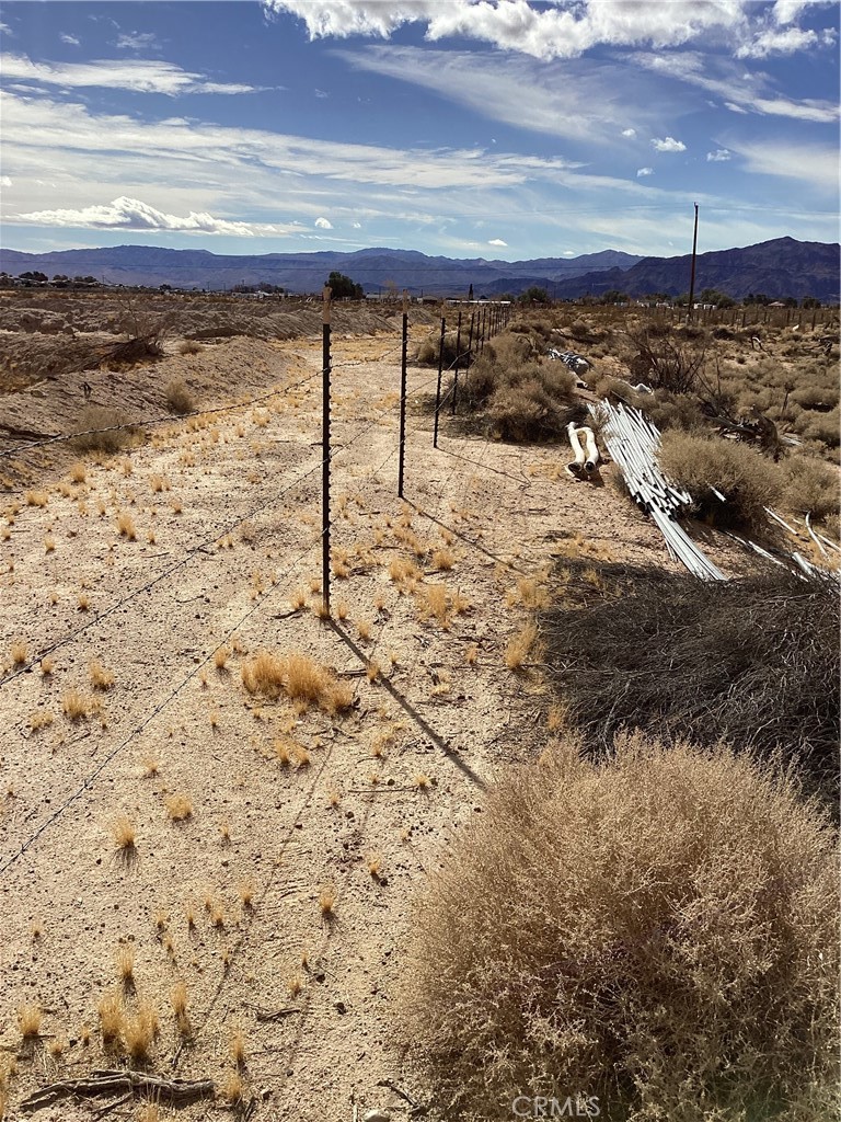 This ten acres is fenced in and has a well, condition unknown and electric access. Located on one of our paved main roads gives easy access to the I-40 and the I-15. We are located about 30 minuets to Barstow for shopping. A very large shipping company will be open in Barstow, bring a stated 25,000 jobs. I figure we will become the suburb's. Now is the time to envest in some land haer I believe.