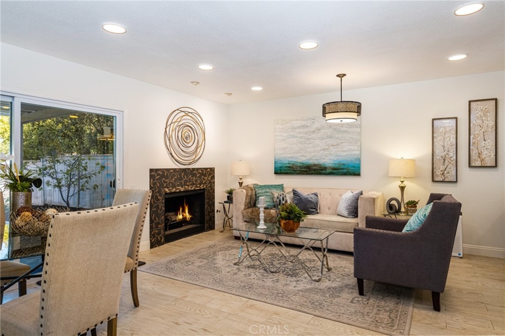Fully remodeled townhome located on a quiet, low traffic cul-de-sac featuring a HUGE BACKYARD with a LAKE VIEW! Great location with no neighbor behind and located just a few steps to the lake. Incredible floor plan with 3 BEDROOMS PLUS A 4th ROOM THAT COULD BE A 4th BEDROOM, DEN OR HOME OFFICE. One bedroom downstairs (great for guests). Very private gated front courtyard with a hidden screen door on the front door. Beautifully UPGRADED KITCHEN with Thomasville cabinets, soft close drawers, European Silestone countertop, stainless steel appliances (all included!), custom vent hood with stainless steel backsplash and a GAS RANGE. Spacious master bedroom with vaulted ceiling opens to a beautifully remodeled master bathroom with an American Standard Brand Jacuzzi tub, a seamless glass enclosure, dual sinks and a custom vanity. Direct access to the 2-car LARGER THAN TYPICAL GARAGE with plenty of built-in cabinets that provides tons of storage. Other features include the following: remodeled bathrooms, custom wrought iron stair railing, custom California Closet systems in all of the bedrooms, freshly painted interior, partially covered patio, Toto toilets, slate tiles in the backyard, dual pane Simonton windows, recessed lighting, newer A/C and Heater and a water softening system. Another plus is that there is plenty of parking available in front of the property. Fantastic Woodbridge resort-style amenities include 2 lakes with sand beach lagoons, boating & fishing, 20 pools, 20+ tennis courts, basketball, volleyball, shuffleboard, bocce, playgrounds, parks, fitness course, and a multitude of family-friendly activities. No Mello Roos, low HOAs & award-winning schools! Centrally located near stores, restaurants, the John Wayne airport, UCI, hospitals and employment centers. Incredible deal on this move-in ready home. Come see it today! Complex looks to be FHA approved - Buyer to verify.