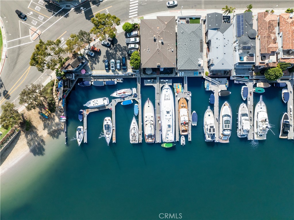 Exceptional opportunity! This fourplex is right on the Newport Bay in a high demand area. The lower-level features two units, each with one bedroom, two baths, and separate patios, while the upper level boasts two units with two bedrooms, two baths, and private balconies. Enjoy two community laundry rooms, two 2-car garages, and two boat docks. Located near Via Lido Village and top-rated restaurants, this prime location provides breathtaking views of the harbor's vibrant activity and stunning sunsets. Additionally, this is a rare opportunity to acquire two contiguous properties, approximately 8,100 sq. ft., on the coveted Newport Beach Via Lido Bayfront—one of the largest opportunities on the bay. The adjacent property 3322 and 3324 are individual condos also listed for sale. Key highlights for both properties include the opportunity to transfer the existing short-term rental permits to new owner, making them a fantastic investment opportunity. Between the two lots, there are a total of four boat docks. Although currently livable, these properties present a rare opportunity for those looking to enhance or develop them.