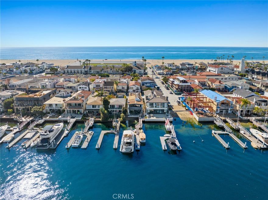 Positioned as a terrific harbor front value with long-term upside potential, this retro-cool Mid-Century Modern bay front home designed by celebrated architect Bill Blurock embraces waterfront living with a stylish nod to the design elements of the 1960s. Timeless clean lines, large windows, and an open interior layout seamlessly merge the indoor and outdoor spaces, offering panoramic views of Newport Harbor.  Underscored by a neutral interior color palette and uncluttered style, the home is characterized by the use of natural materials including wood beam ceiling detail, concrete floors, and a stone fireplace.  Walls of glass open to a waterfront patio perfect for al fresco dining and enjoying the active harbor views. The private dock accommodates a vessel of approximately 56' and the side-tie is perfect for a Duffy boat and water toys.  With four bedrooms, four bathrooms, and an office-loft, there is room for everyone to enjoy funs times together on the water. The primary suite with its separate sitting area delights in endless views of the bay, and twinkling city lights. Characterized by a minimalist exterior facade, the home blends form and function, offering a timeless retreat that celebrates the beauty of waterfront living. Conveniently positioned Mid-Peninsula just a short stroll, bike or golf cart ride from the myriad shops and restaurants that the Balboa Peninsula is known for.  An amazing bay front lifestyle opportunity.