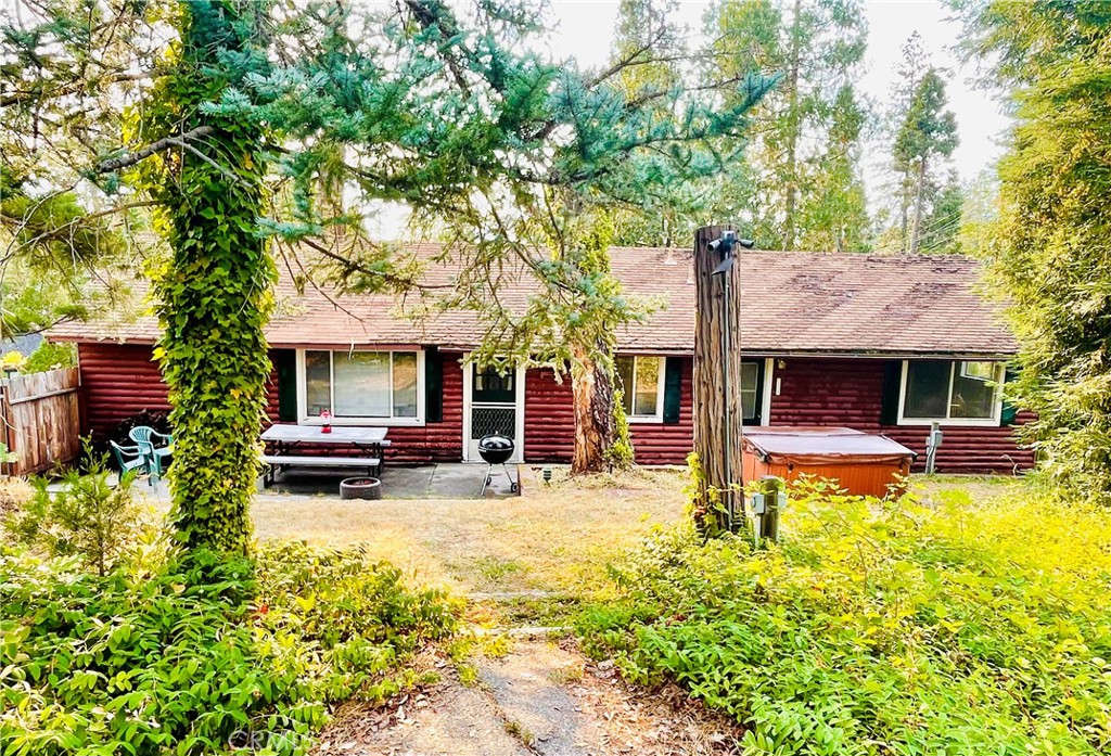 Your lake house dreams start here! Tremendous value in the land and location. You’ll love this classic Bass Lake cabin with original touches—first time on the market in almost 25 years and owned by only two families since it was built in 1948. Located in one of the best neighborhoods in Bass Lake—close to everything yet set back off the main road with plenty of peace and privacy. Walk to The Pines Village or stroll down to your private beach club and deep water boat slip at Brier Dock, just a few minutes walk away! This original 1-story 2BR, 2Ba home can be enjoyed for many more years to come, or you can redevelop the large 9,147 SF Lot with a new full size main house, a 1200 SF ADU, or both! (Per Madera County Planning, Buyer to make own investigations.) Plenty of charm, with multiple living areas, classic kitchen, wood burning stove, hot tub, storage shed for your lake toys, parking for 4+ cars and more. Bring the boat, bring the kids, even bring the in-laws!