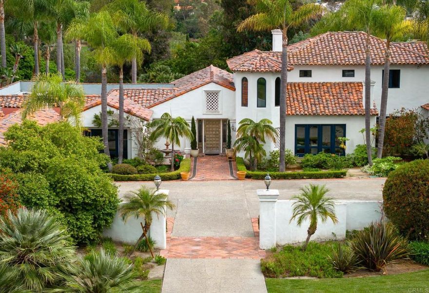 Centrally located in a prime location within the prestigious Covenant of Rancho Santa Fe.  This classic Mediterranean estate is within walking distance to the Rancho Santa Fe Golf and Tennis Clubs, the Rancho Santa Fe Village with shopping, restaurants, The Inn and  Roger Rowe schools and is just a few minutes to the coast with some of the finest beaches.   As you enter the 2.01-acre property thru its private gates you get a sense of warmth, presence and style.  The main residence is approximately 6,900 sq feet and is complete with imported stone, tile and hardwood floors.  There are five suites of bedrooms in the main house.   The living room and dining room are perfect for formal entertaining with a kitchen family room combination being ideal for everyday enjoyment.  In addition, there is a dedicated office with fireplace.  The numerous sets of French doors lead out to the covered patio and the private back yard with areas for lounging, playing ball or swimming in the sparkling pool. There is an additional one- bedroom guesthouse with a full bath, and an oversized pool house complete with a kitchen and full bathroom(not included in the main house sq footage).   The private primary suite is located on the second level with a fireplace, a private balcony showcasing the beautiful views of the RSF Golf course and beyond, large bathroom and oversized dressing room.  Garaging for 4 cars.  Oversized motor court. Bill Matzinger Build.  Close to trail system.  Combining this prime location along with exceptional design, privacy and views make this estate a rare and special find within the exclusive Covenant community.